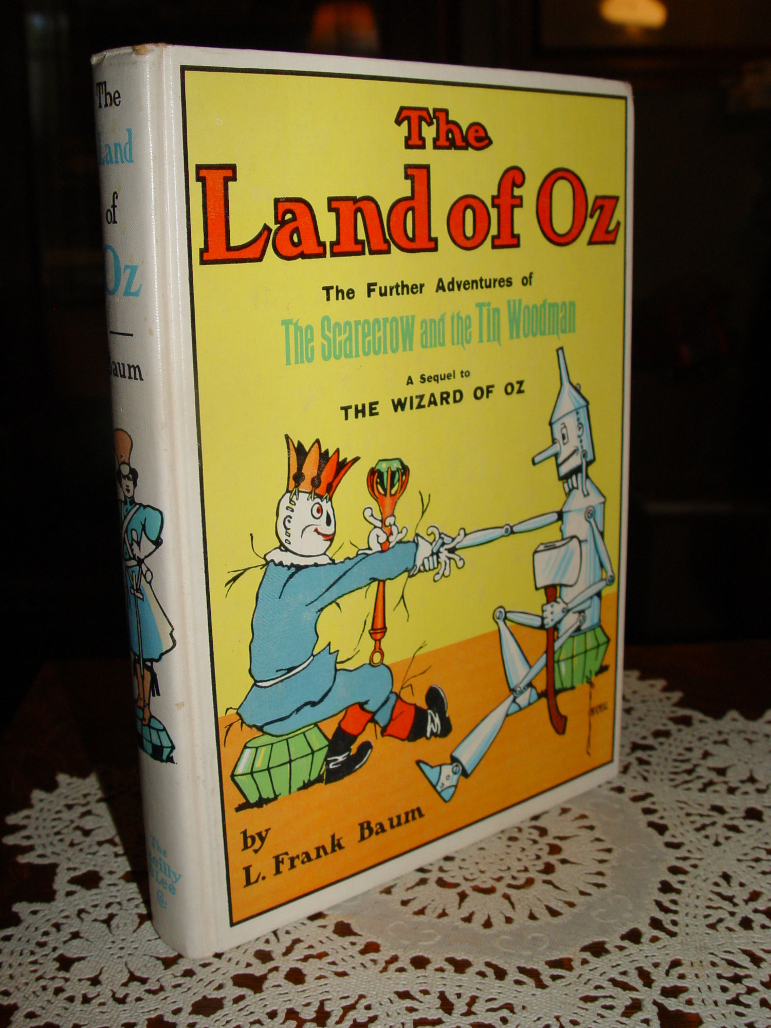 The
                Land of Oz; The Scarecrow and the Tin Woodman by L.
                Frank Baum