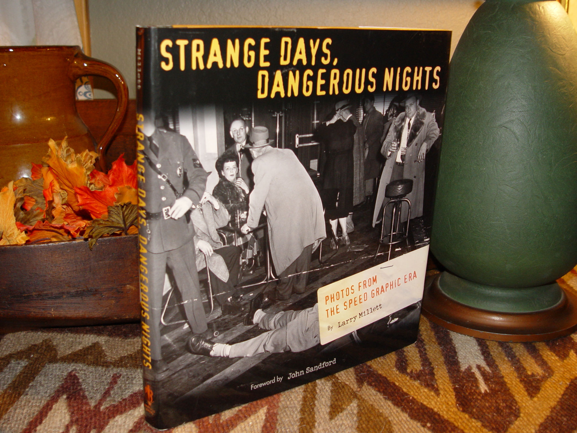 Strange Days,
                        Dangerous Nights: Photos from the Speed Graphic
                        Era Hardcover – Illustrated, 2004 by Larry
                        Millett